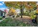 Lush backyard featuring mature trees, patio seating, and a well-manicured lawn perfect for outdoor entertaining at 12601 Slippery Rock Rd, Indianapolis, IN 46236
