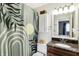 Cozy bathroom featuring a vanity with granite countertop and patterned shower curtain at 12601 Slippery Rock Rd, Indianapolis, IN 46236