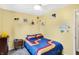 bedroom featuring a whimsical design, ample natural light, and a playful planetary mobile above the bed at 12601 Slippery Rock Rd, Indianapolis, IN 46236