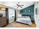 Comfortable bedroom with a ceiling fan, dresser, and natural light at 12601 Slippery Rock Rd, Indianapolis, IN 46236