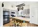 Well-lit kitchen featuring stainless steel appliances, a kitchen island, and ample counter space at 12601 Slippery Rock Rd, Indianapolis, IN 46236