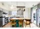 Bright kitchen with an island featuring barstool seating and stainless steel appliances at 12601 Slippery Rock Rd, Indianapolis, IN 46236