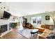 Bright living area with modern fireplace and open layout to a breakfast bar at 12601 Slippery Rock Rd, Indianapolis, IN 46236