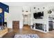 Living room with wood floors, fireplace, and stylish decor including modern lighting at 12601 Slippery Rock Rd, Indianapolis, IN 46236