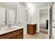 Bathroom with double sinks, wood cabinets and tile floor at 13788 Four Seasons Way, Carmel, IN 46074