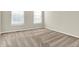 This cozy bedroom has neutral walls and plush carpeting at 13788 Four Seasons Way, Carmel, IN 46074