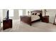 Well appointed bedroom with soft carpeting, a plush bed and two windows for natural light at 13788 Four Seasons Way, Carmel, IN 46074