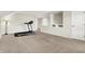 Spacious bonus room featuring neutral carpet, a treadmill, and access to the other rooms at 13788 Four Seasons Way, Carmel, IN 46074