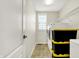 The laundry room features appliances and black storage bins at 13788 Four Seasons Way, Carmel, IN 46074
