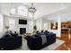 Bright living room with high ceilings, large windows, fireplace, and hardwood floors at 13788 Four Seasons Way, Carmel, IN 46074
