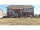 Spacious backyard featuring a brick-and-siding house and patio furniture at 14034 Wicklow Ln, Fishers, IN 46040