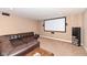 Home theater with a large sectional couch, speakers, and a screen at 14034 Wicklow Ln, Fishers, IN 46040