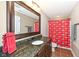 Bathroom with a dark wood vanity, granite countertop, and Ohio State shower curtain at 14034 Wicklow Ln, Fishers, IN 46040