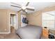 Bedroom with a ceiling fan and a window with views of the backyard, next to the closet door at 14034 Wicklow Ln, Fishers, IN 46040