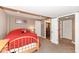 View of the bedroom with beige walls and carpeting and an ensuite bathroom at 14034 Wicklow Ln, Fishers, IN 46040