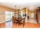Cozy dining room with sliding door access to patio and stairs to a basement at 14034 Wicklow Ln, Fishers, IN 46040