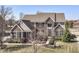 Stunning two-story brick home with meticulous landscaping, black shutters, and beautiful architectural details at 14034 Wicklow Ln, Fishers, IN 46040