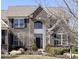 Charming brick home featuring well-manicured landscaping and dark shutters, offering classic curb appeal at 14034 Wicklow Ln, Fishers, IN 46040