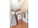 Spacious foyer features wood and carpet flooring, staircase with iron spindles, and ample natural light at 14034 Wicklow Ln, Fishers, IN 46040