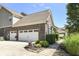 Spacious three car garage with ample parking and a landscaped walkway at 14034 Wicklow Ln, Fishers, IN 46040