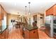 Open concept kitchen with a center island and stainless steel appliances at 14034 Wicklow Ln, Fishers, IN 46040
