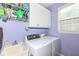 Functional laundry room with washer, dryer, sink and ample storage space at 14034 Wicklow Ln, Fishers, IN 46040