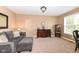 Comfortable living room with cozy seating, natural light, neutral tones, and elegant décor at 14034 Wicklow Ln, Fishers, IN 46040