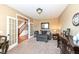 Cozy living room with plush seating, elegant decor, neutral walls, and a view to the staircase at 14034 Wicklow Ln, Fishers, IN 46040