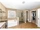 Bright main bathroom features a soaking tub, shower, closet, and tile floor at 14034 Wicklow Ln, Fishers, IN 46040