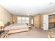 A spacious primary bedroom with four-poster bed, ample natural light, and neutral decor at 14034 Wicklow Ln, Fishers, IN 46040