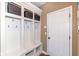 Organized mudroom with built-in storage and seating to contain the outdoor mess at 14034 Wicklow Ln, Fishers, IN 46040