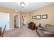 Inviting office space with warm, neutral tones and classic wood furniture, showcasing a peaceful work environment at 14034 Wicklow Ln, Fishers, IN 46040