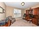 Cozy home office featuring built in shelves, a large window, and comfortable furniture at 14034 Wicklow Ln, Fishers, IN 46040