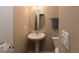 Elegant half-bathroom featuring a pedestal sink and stylish fixtures at 14309 Shooting Star Dr, Noblesville, IN 46060
