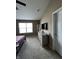 Bright bedroom with neutral walls, carpet flooring and a dresser with mounted television at 14309 Shooting Star Dr, Noblesville, IN 46060