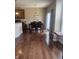 Bright dining area with hardwood floors and stylish decor, seamlessly connected to the kitchen at 14309 Shooting Star Dr, Noblesville, IN 46060