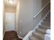Inviting entryway featuring a staircase and convenient access to the upper level at 14309 Shooting Star Dr, Noblesville, IN 46060