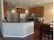 Kitchen with stainless steel appliances and granite countertops with an open layout to dining area at 14309 Shooting Star Dr, Noblesville, IN 46060