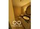 Cozy powder room featuring a vanity with a sink and an decorative mirror at 15237 Citation Rd, Carmel, IN 46032