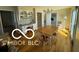 Bright dining room with wood floors, chandelier, and sunny windows at 15237 Citation Rd, Carmel, IN 46032