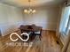 Bright dining area with hardwood floors, chandelier, and decorative molding, ideal for Gathering gatherings at 15237 Citation Rd, Carmel, IN 46032