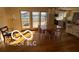 Inviting dining room with hardwood floors and sliding glass doors showcasing a serene view at 15237 Citation Rd, Carmel, IN 46032