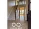 Bright foyer features a staircase, light-colored walls, and water views beyond at 15237 Citation Rd, Carmel, IN 46032