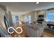 Open kitchen with granite counters, white cabinets, stainless appliances, and an island at 15237 Citation Rd, Carmel, IN 46032