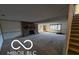 Open living room boasting a brick fireplace and large windows offering natural light at 15237 Citation Rd, Carmel, IN 46032