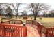 Spacious backyard view from wood deck; large backyard featuring grass and storage shed at 1739 Forest Dr, Indianapolis, IN 46227