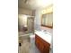 Cozy bathroom boasts a vanity, bathtub with shower, and a mirrored medicine cabinet at 1739 Forest Dr, Indianapolis, IN 46227