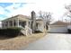 Attractive single-Gathering home with detached garage, stone chimney, and covered front porch at 1739 Forest Dr, Indianapolis, IN 46227
