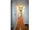 Inviting hallway with hardwood floors, neutral paint, and recessed lighting, leading to multiple rooms at 1739 Forest Dr, Indianapolis, IN 46227