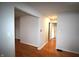 Bright hallway with hardwood floors and neutral walls, connecting various rooms in the home at 1739 Forest Dr, Indianapolis, IN 46227